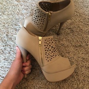 Cream colored booties with cut outs